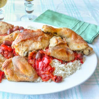 Chicken Cacciatore shown served with rice on a white platter
