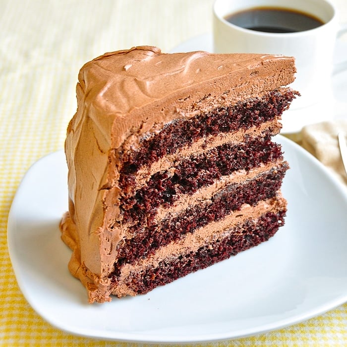 Chocolate Buttercream Frosting on a slice of 4 layer cake