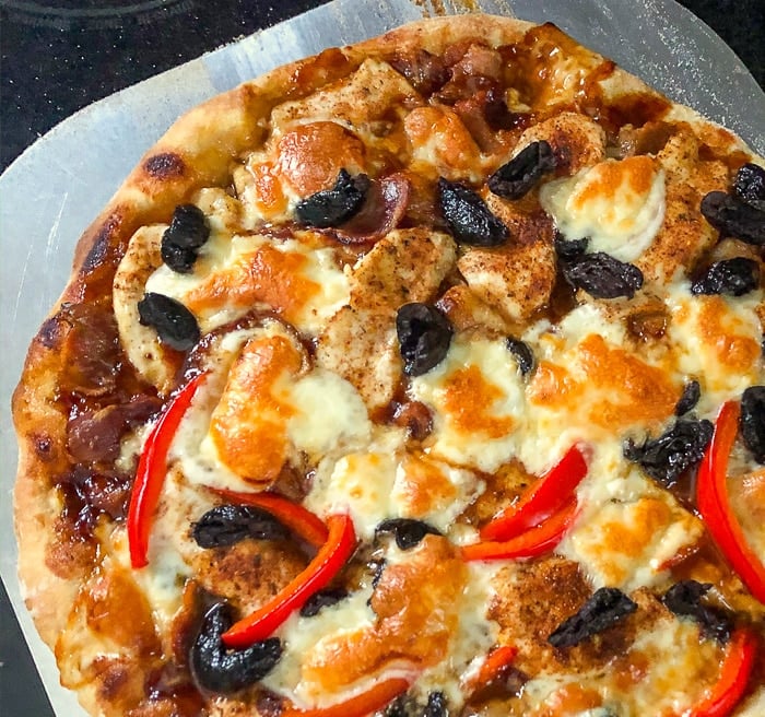 Crispy Thin Crust Barbecue Chicken Pizza with sun dried black olives and peppers