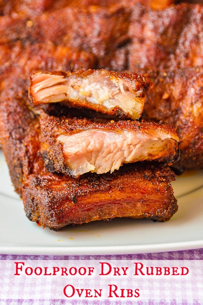 Foolproof Dry Rubbed Oven Ribs photo shown on a white platter with title text added for Pinterest