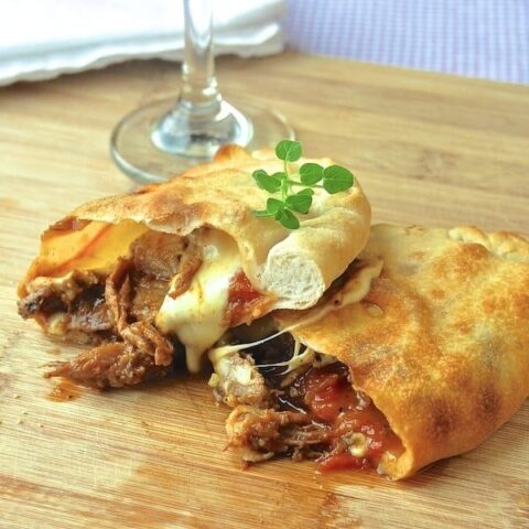 Smoked Spice Pulled Pork Calzones with filling showing