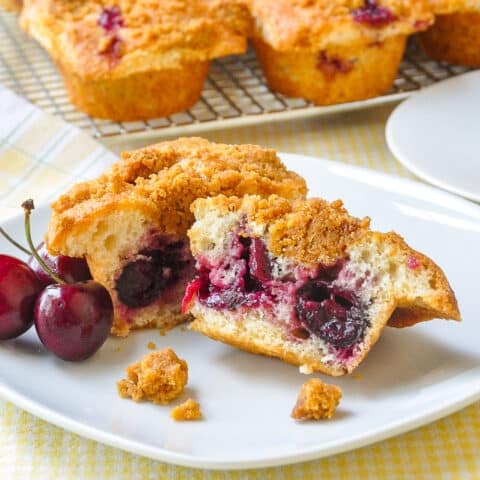 Cherry Muffins with Graham Crumb Streusel cut in half to show whole cherries in the centre