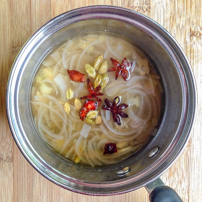 Preparing the spices fo Asian Spice Brined Roast Chicken in a small saucepan