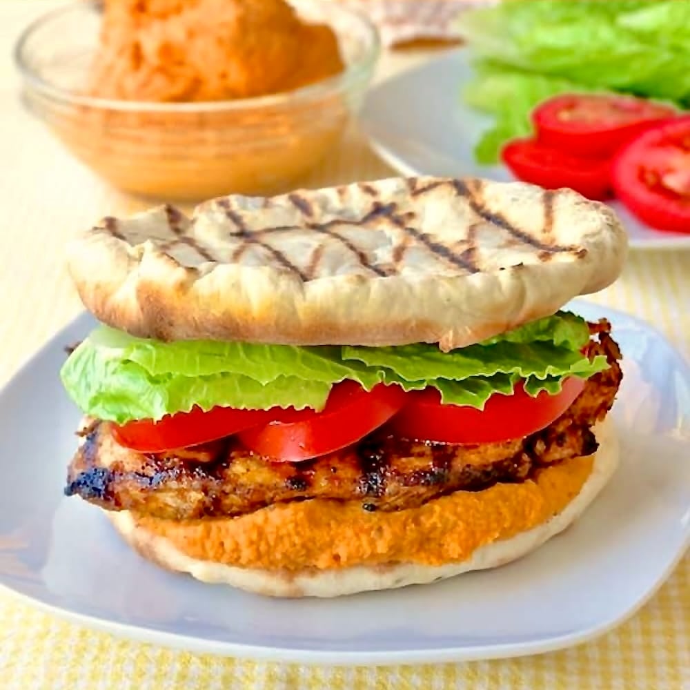 Moroccan Marinated Flatbread Grilled Chicken Burgers with Red Pepper Hummus.