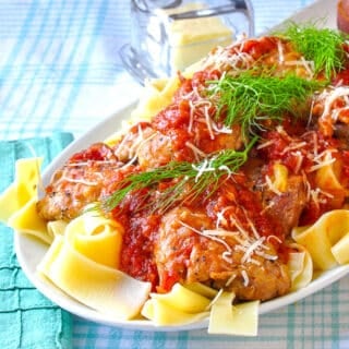 Tomato Fennel Braised Chicken Thighs on a white platter