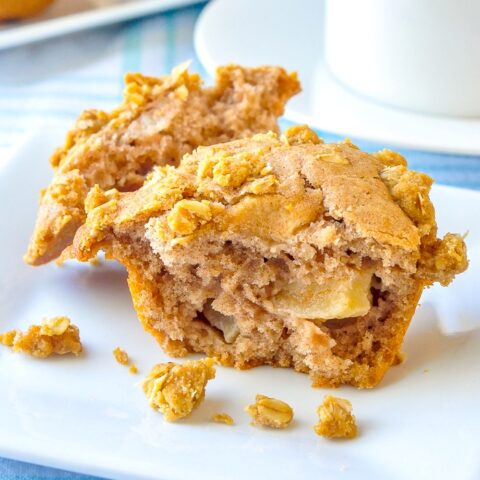 Apple Crumble Muffins split open to reveal apple chunks inside