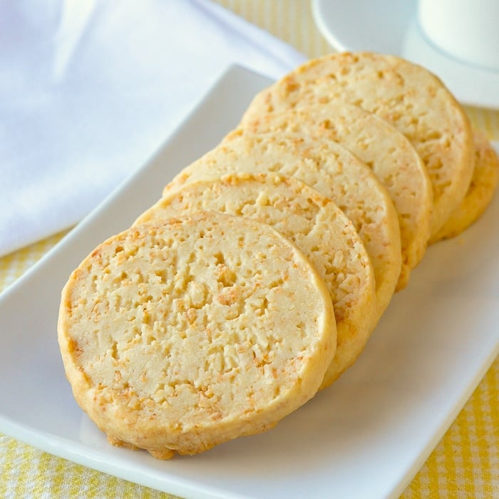 Toasted Coconut Shortbread Cookies close up image of cookies on white serving plate