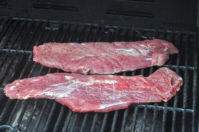 Tenderloin being added to the grill.