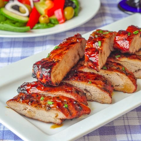 Low Fat Honey Garlic Boneless Ribs close up photo of cut ribs on a white serving platter