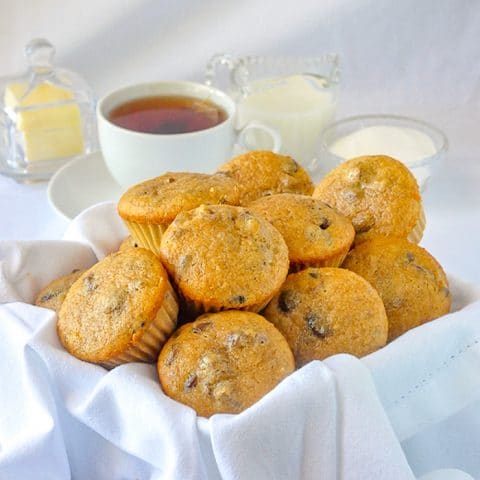 Butter Tart Muffins close up of muffins in a basket with tea service in background