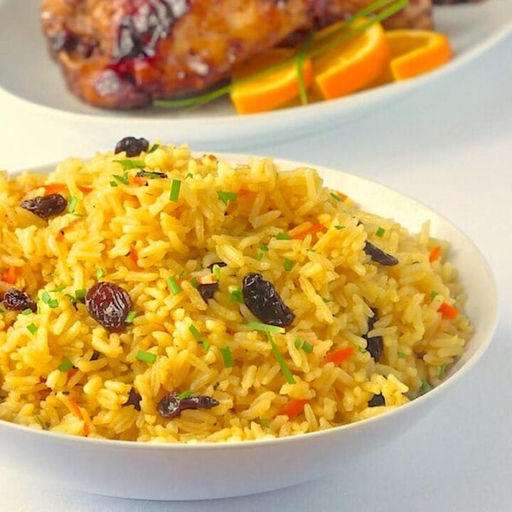 Carrot Raisin Rice Pilaf in a white serving bowl