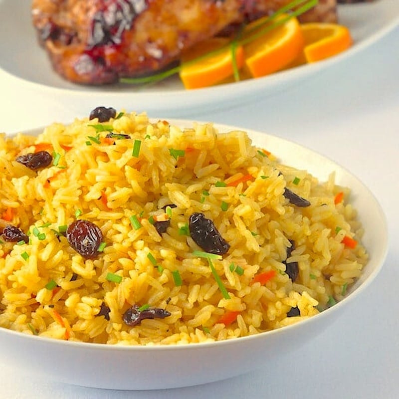 Carrot Raisin Rice Pilaf in a white serving bowl