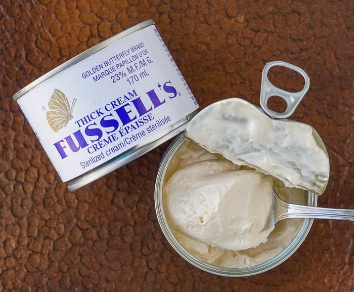 Can of Fussell's Cream opened with spoon inside