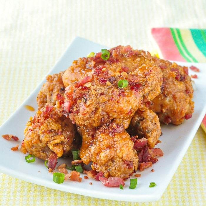 Crispy Chili Bacon Maple Hot Wings on a white serving platter