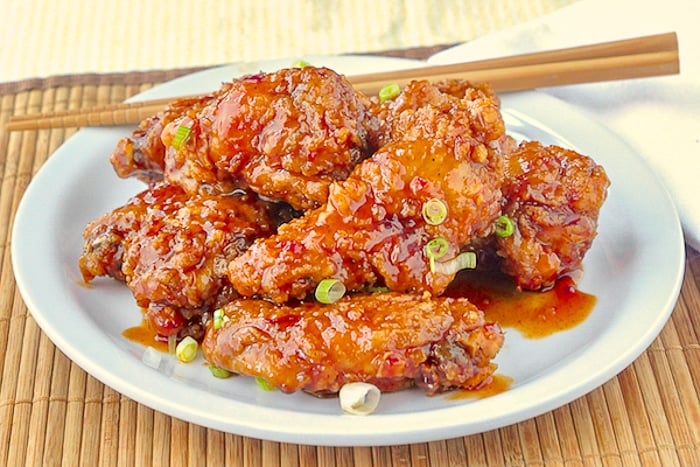 General Tso Chicken Wings wide shot photo of wings on white plate
