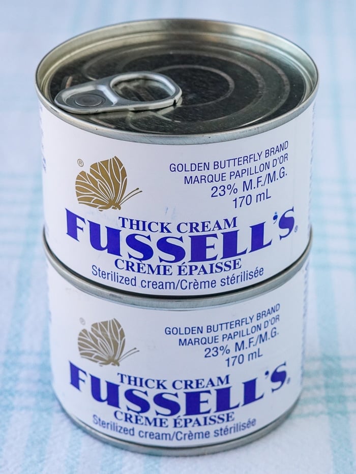 Two cans of Fussell's Cream stacked