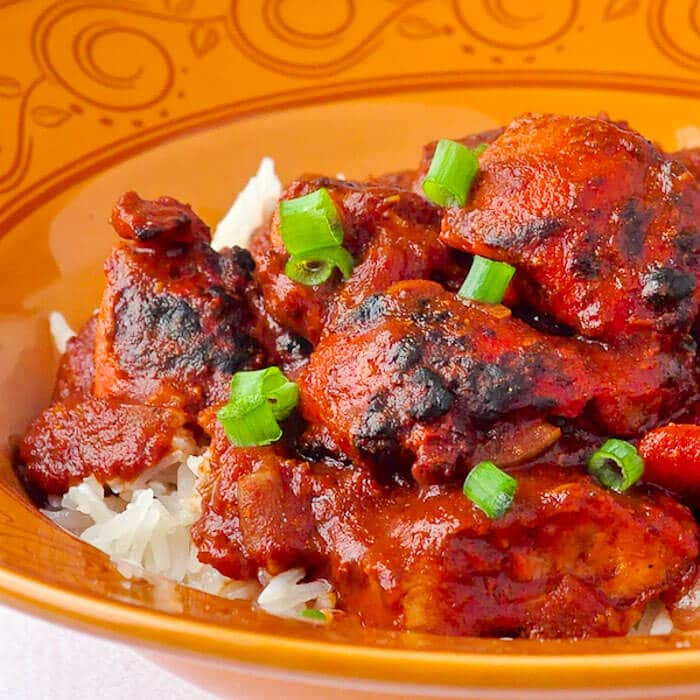 Chicken Tikka Masala image served over streamed rice.