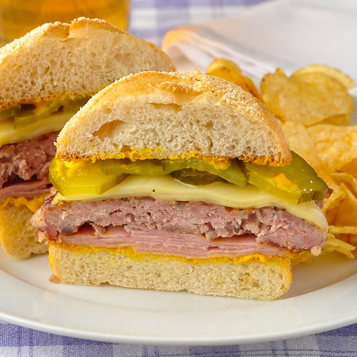 Cuban Sandwich Burger cut in half to show the centre of the burger