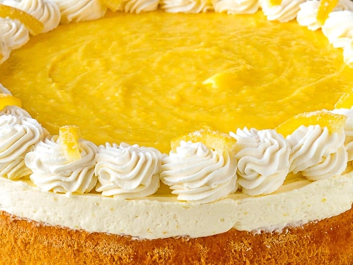 Lemon Mousse Cake close up photo of the top of the uncut cake