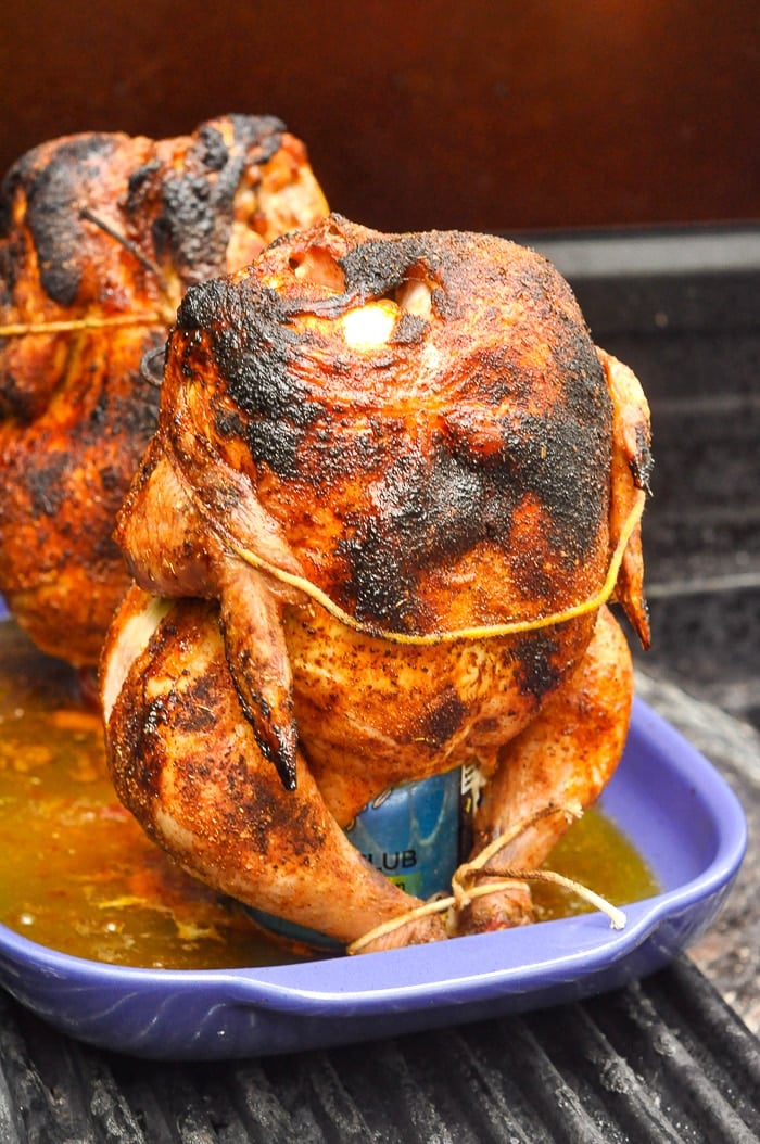 Beer Butt Chicken pictured fully cooked on a gas BBQ