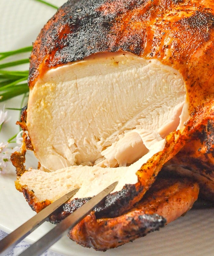 Close up photo of carving a Beer Butt Chicken