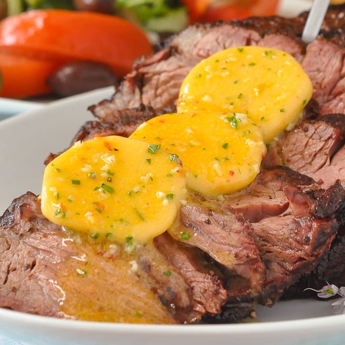 BBQ Prime Rib with Garlic Chili Butter close up photo of melting chili butter