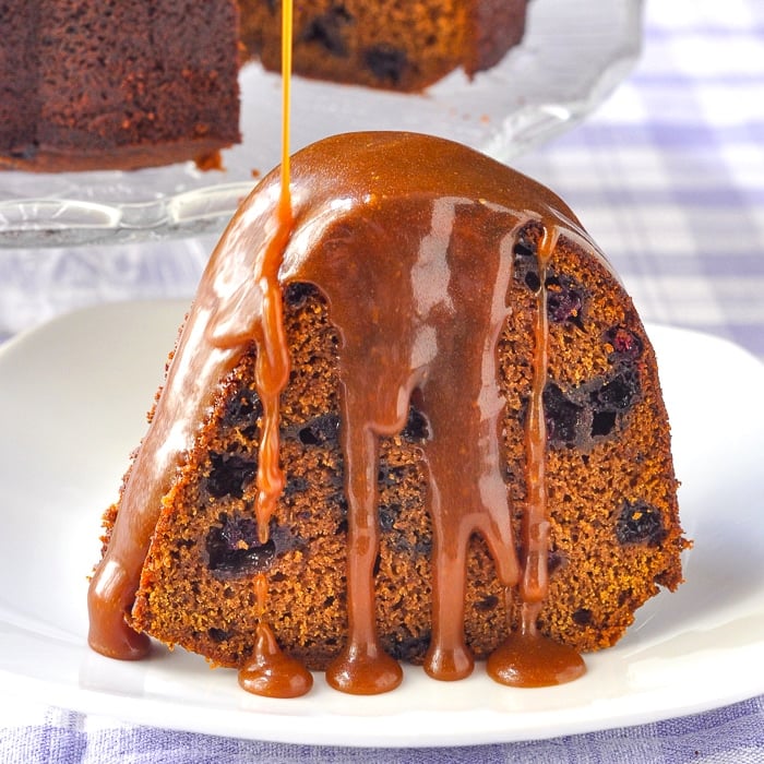 Blueberry Gingerbread Cake with Toffee Sauce close up photo of single slice