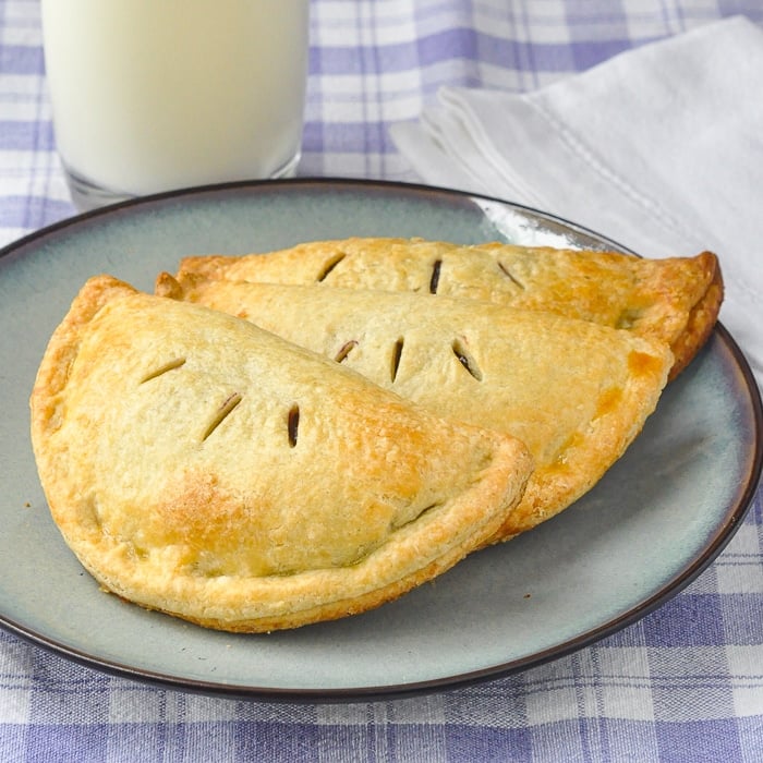 Blueberry Turnovers uncut on a blue serving plate