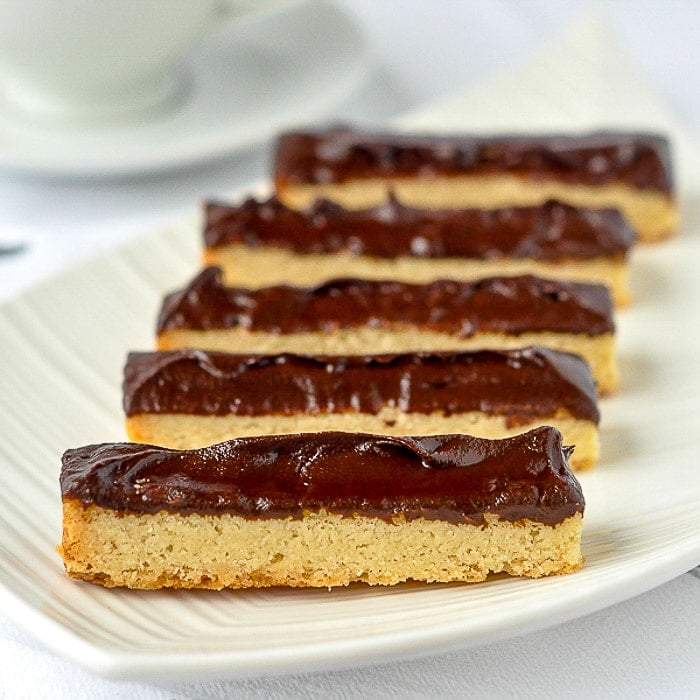 Chocolate Dipped Chocolate Shortbread close up photo of finished shortbreads on a white platter