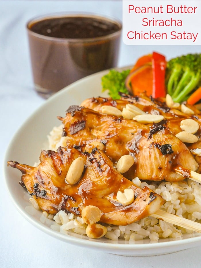 Peanut Butter Sriracha Chicken Satay photo shown on bed of rice with title text added for Pinterest