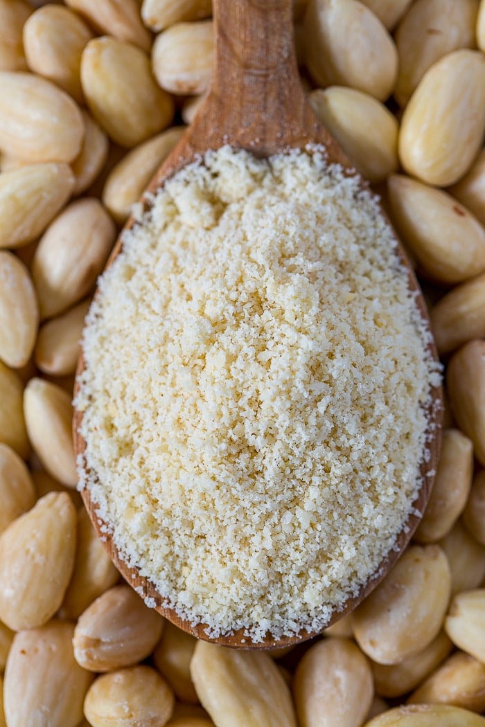 Ground almonds on a wooden spoon
