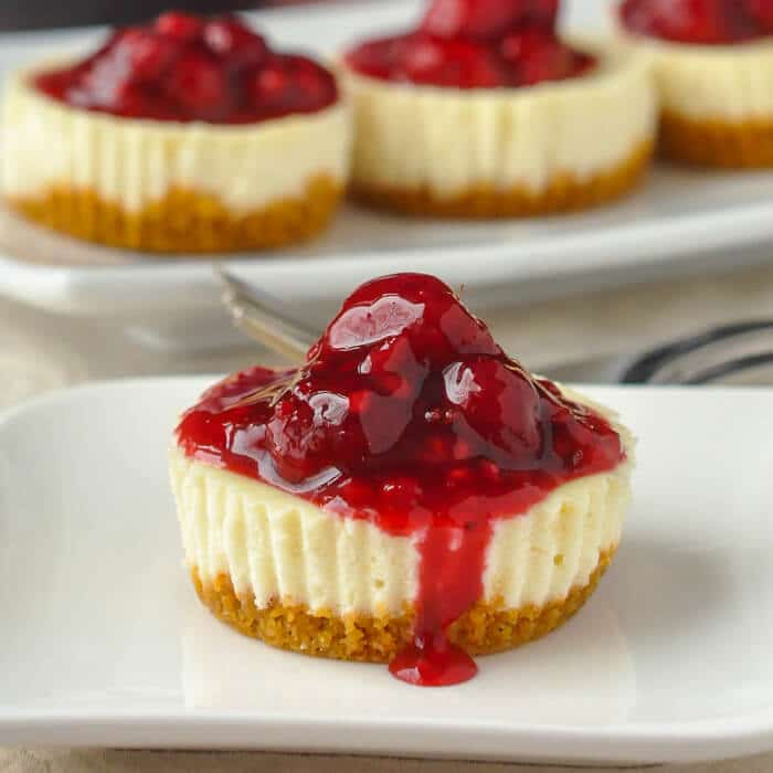 For a classic cheesecake with a tangy taste, you have to try my lemon cheesecake recipe! Lemon Raspberry Cheesecake Recipe - Mini Lemon Cheesecakes With Raspberry Sauce Only 202 Calories Each