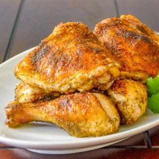 Homemade Italian Seasoning on Roast Chicken shown on white serving platter