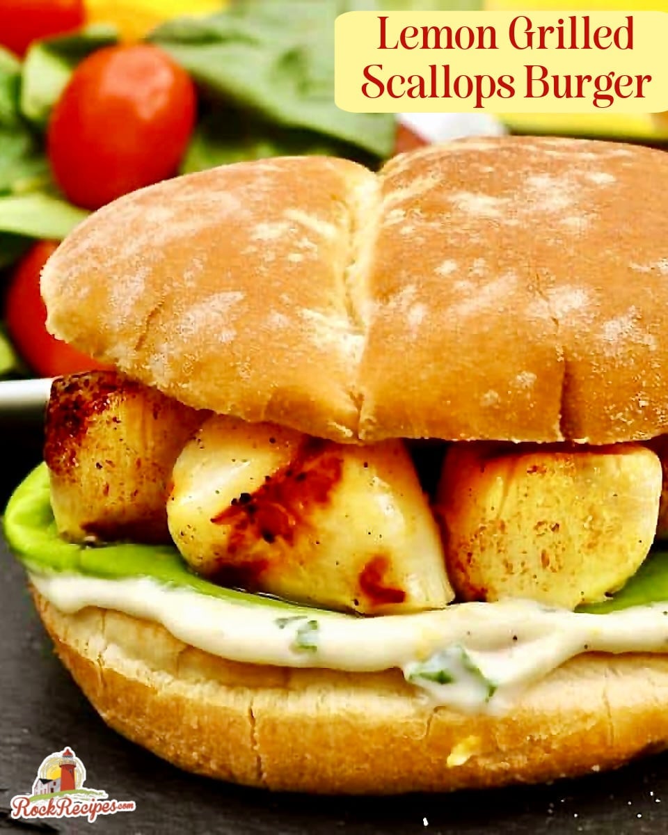 Close Cropped Photo of one Grilled Scallops Burger with Lemon Basil Mayo with title text added for social media.