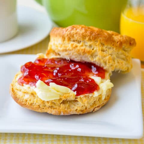 Homemade Butter with Strawberry Jam on Buttermilk Biscuits