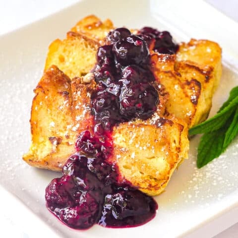 Bread pudding french toast pictured with mint and powdered sugar