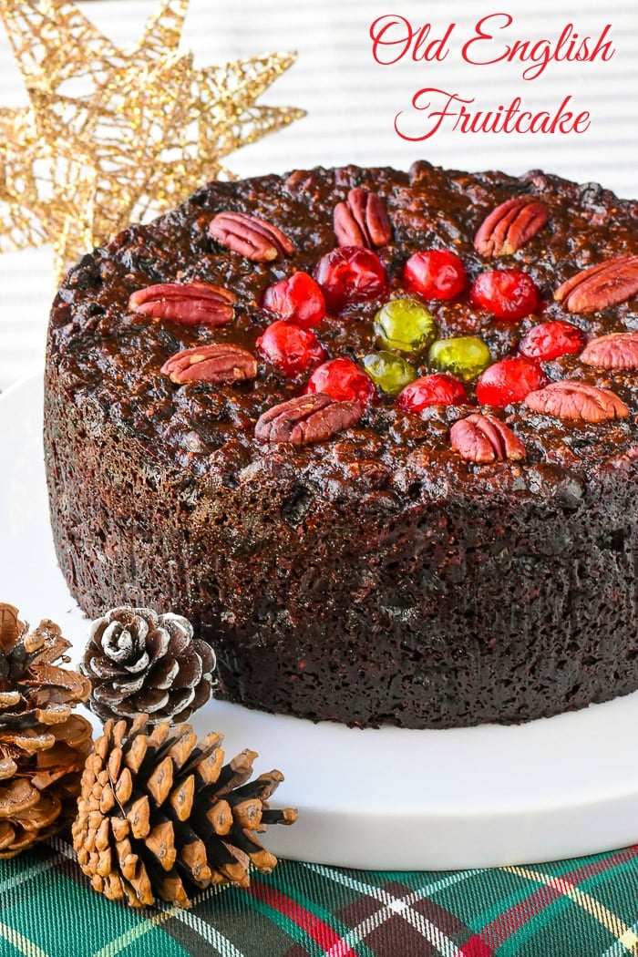 Old English Fruitcake photo of uncut cake with title text added for Pinterest