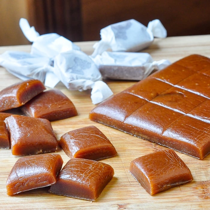 Homemade Chewy Caramels shown being cut