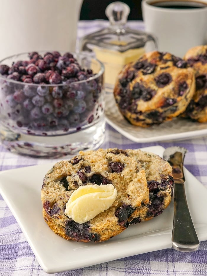 Blueberry Scones, Whole wheat and no sugar added shown with butter spread on scone.