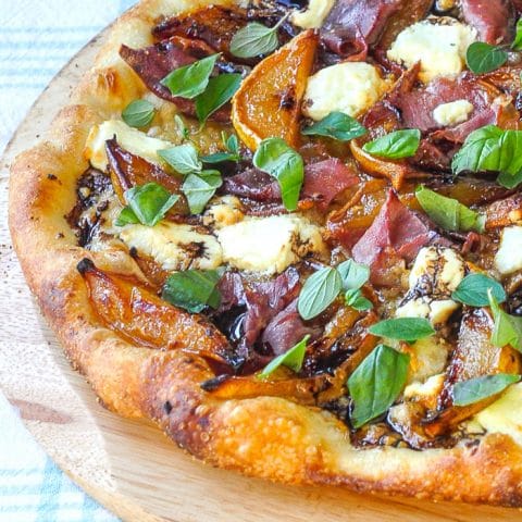 Caramelized Pear Prosciutto Pizza close up photo of about one quarter of the finished pizza