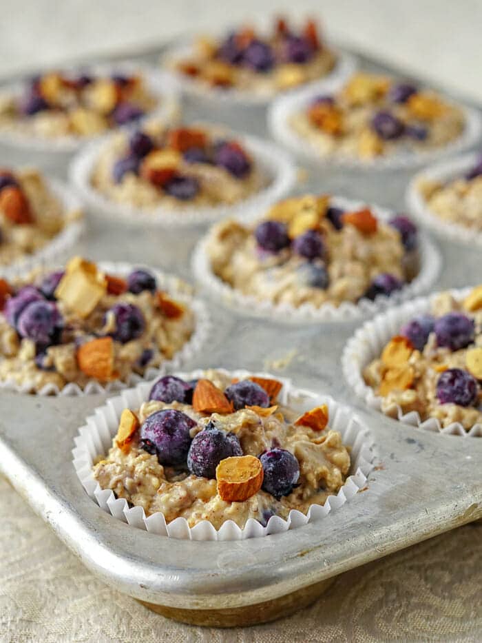 Blueberry Almond Butter Muffins in baking tray, ready for the oven.