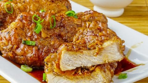 Double Crunch Honey Garlic Pork Chops sliced to show interior after cooking