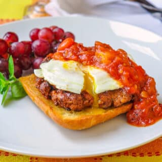 Homemade Chorizo Sausage shown with eggs and spicy tomato compote on toast