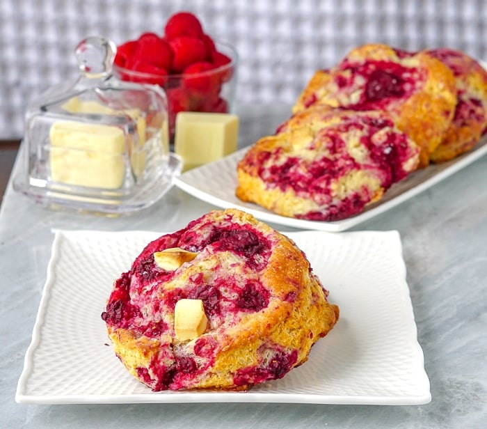 Raspberry White Chocolate Scones photo od a single scone on a white plate