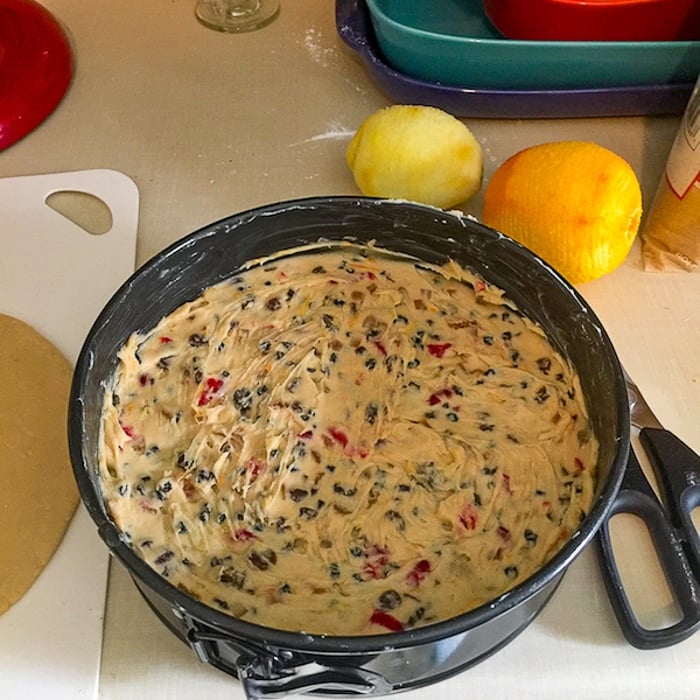 Spread half the cake batter in the prepared cake pan.