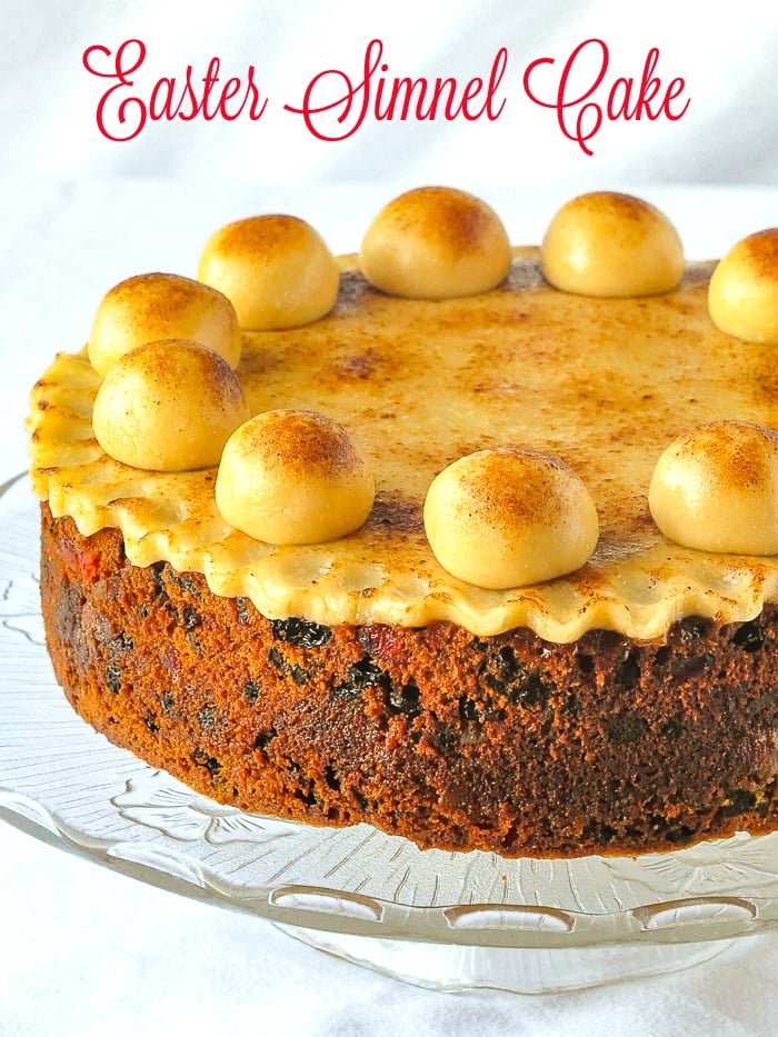 Simnel Cake photo on a clear glass stand with title text added for Pinterest