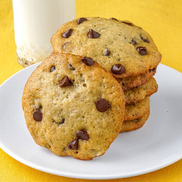 Banana Bread Cookies shown with a cold glass of milk