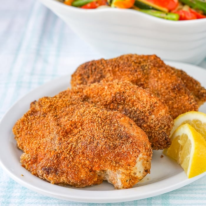 Copycat Barbecue Shake and Bake close up photo of cooked chicken breasts on a serving platter.