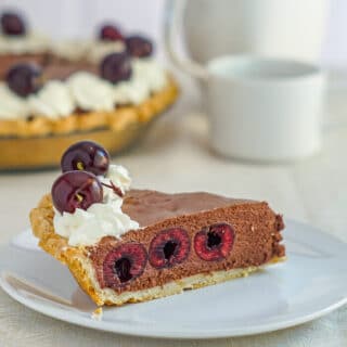 Black Forest Pie photo of a single slice with pie in background