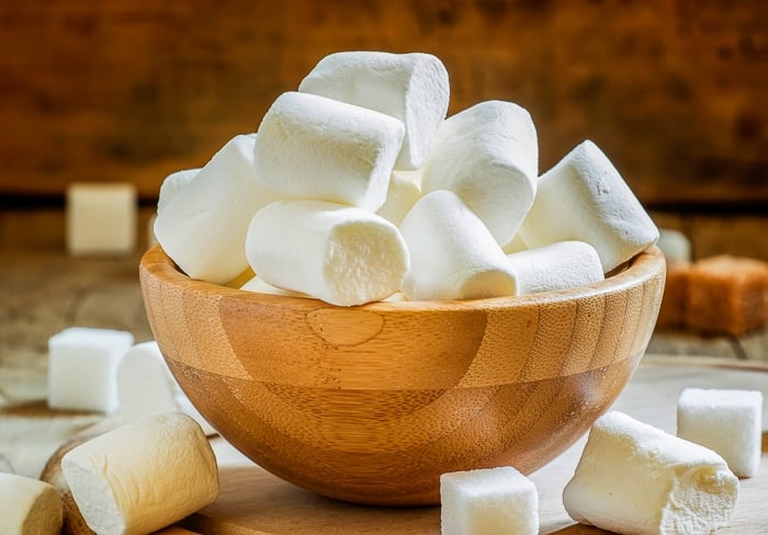 Jumbo marshmallows in a wooden bowwl. Stock image from Depositphotos